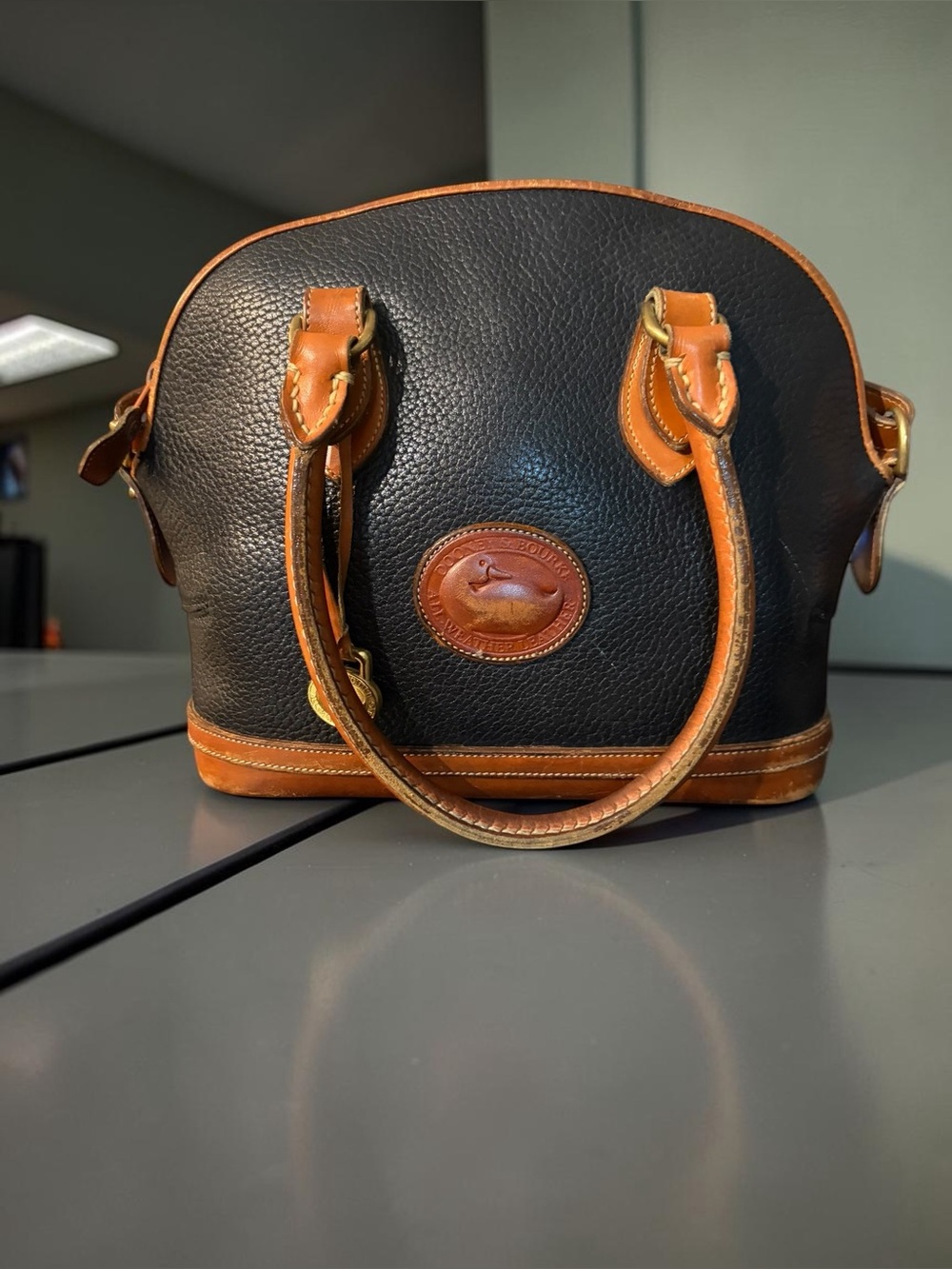 Dooney & Bourke Black Leather Satchel with Tan Trim